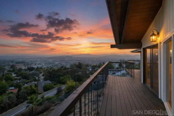 a view of balcony with wooden floor and stairs