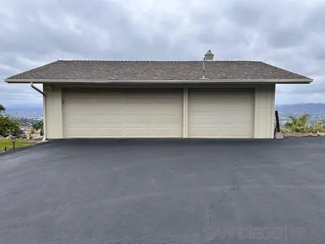 a view of a pathway with a yard