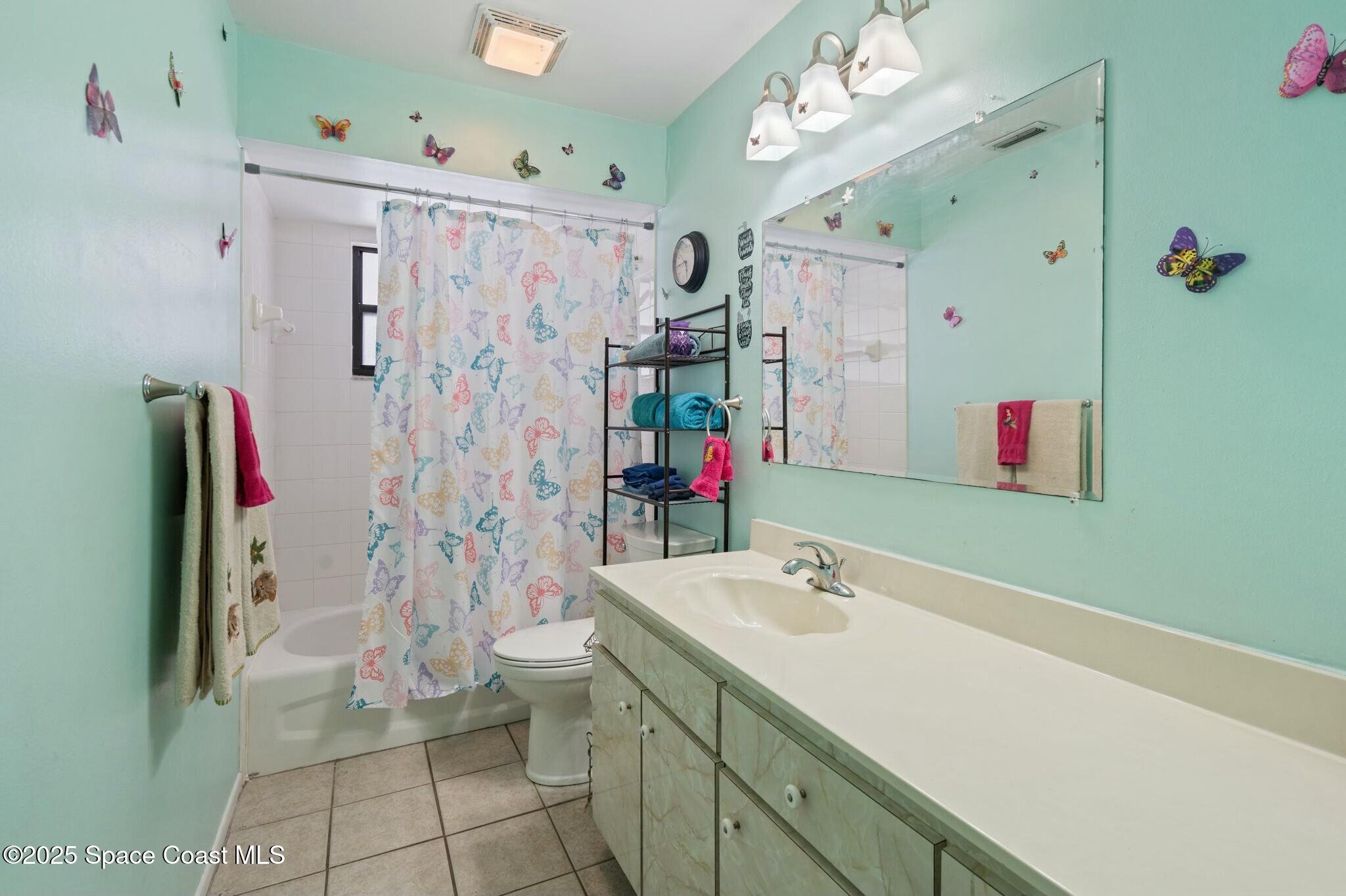 1550 Creel Road Northeast Palm Bay, FL 32905 - Photo 15 of 27 a bathroom with a shower sink and mirror