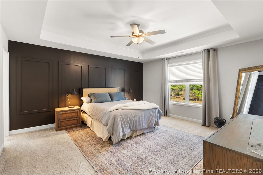 84 Rainy Beck Way Erwin, NC 28339 - Photo 20 of 36 a spacious bedroom with a large bed and a window