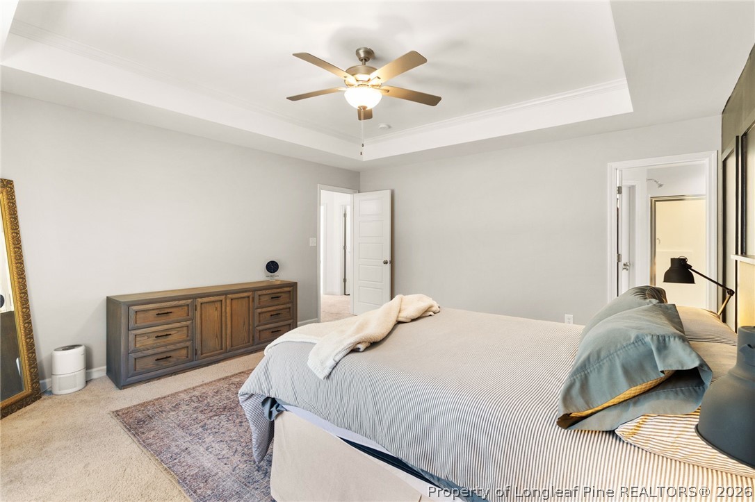 84 Rainy Beck Way Erwin, NC 28339 - Photo 21 of 36 a bedroom with a large bed and a ceiling fan