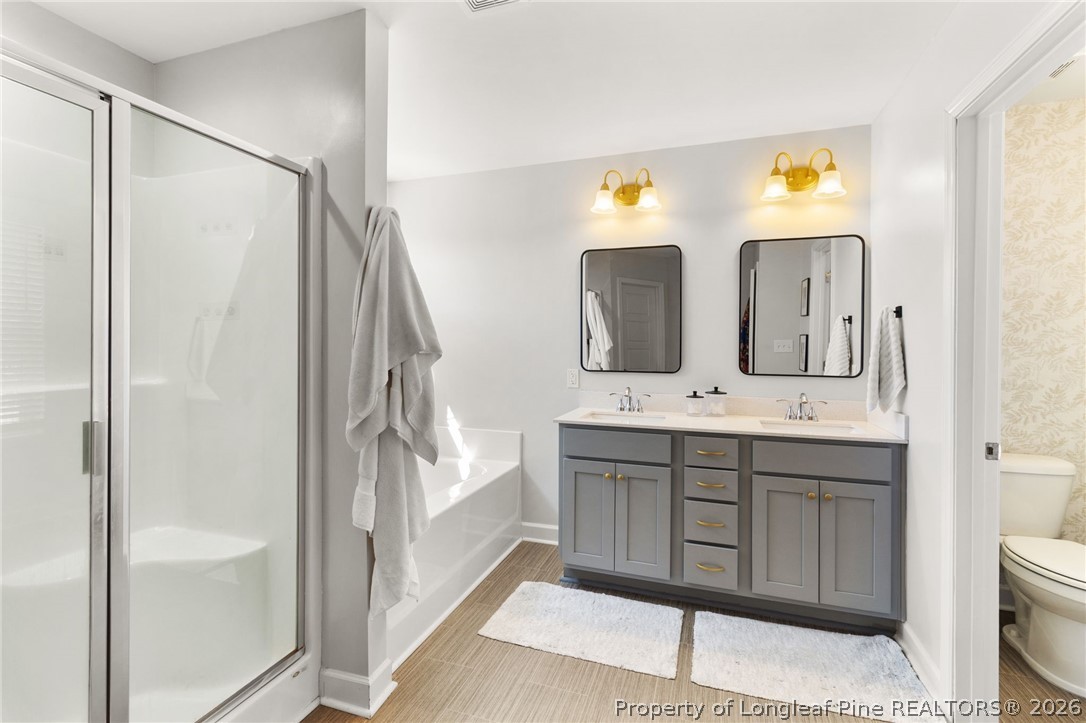 84 Rainy Beck Way Erwin, NC 28339 - Photo 22 of 36 a spacious bathroom with a double vanity sink and a mirror