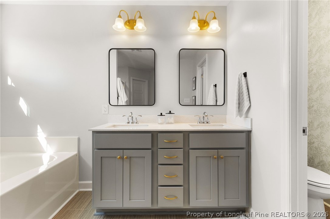 84 Rainy Beck Way Erwin, NC 28339 - Photo 24 of 36 a bathroom with 2 sink and a mirror