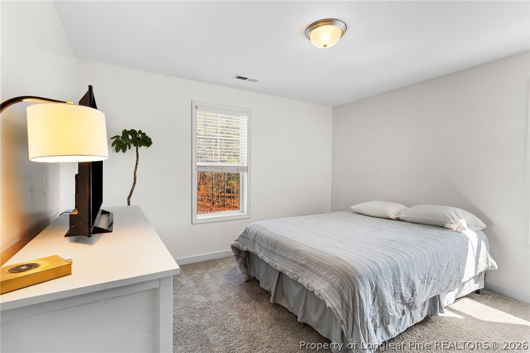 84 Rainy Beck Way Erwin, NC 28339 - Photo 26 of 36 a bedroom with a bed and a window