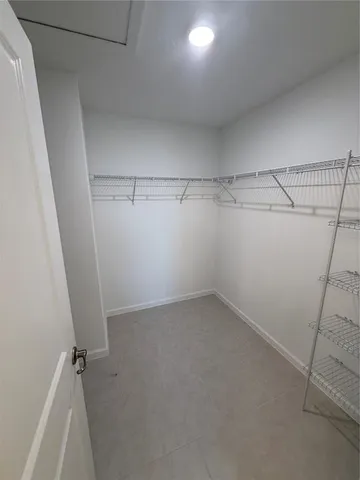 a view of a room with racks on the wall