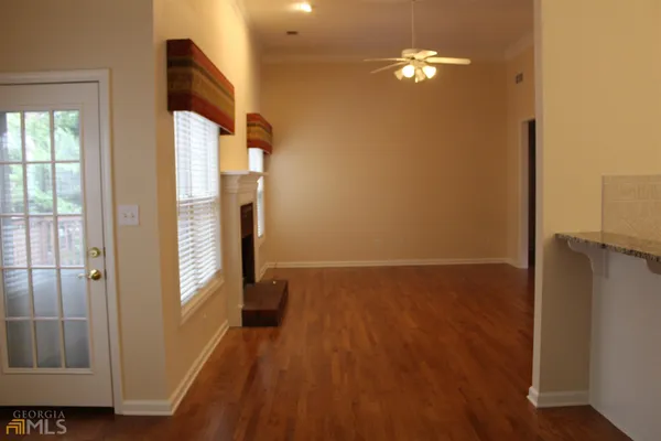 a view of a livingroom with wooden floor