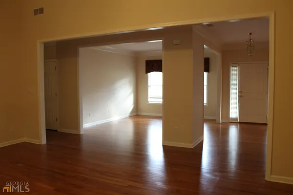 a view of gallery with wooden floor