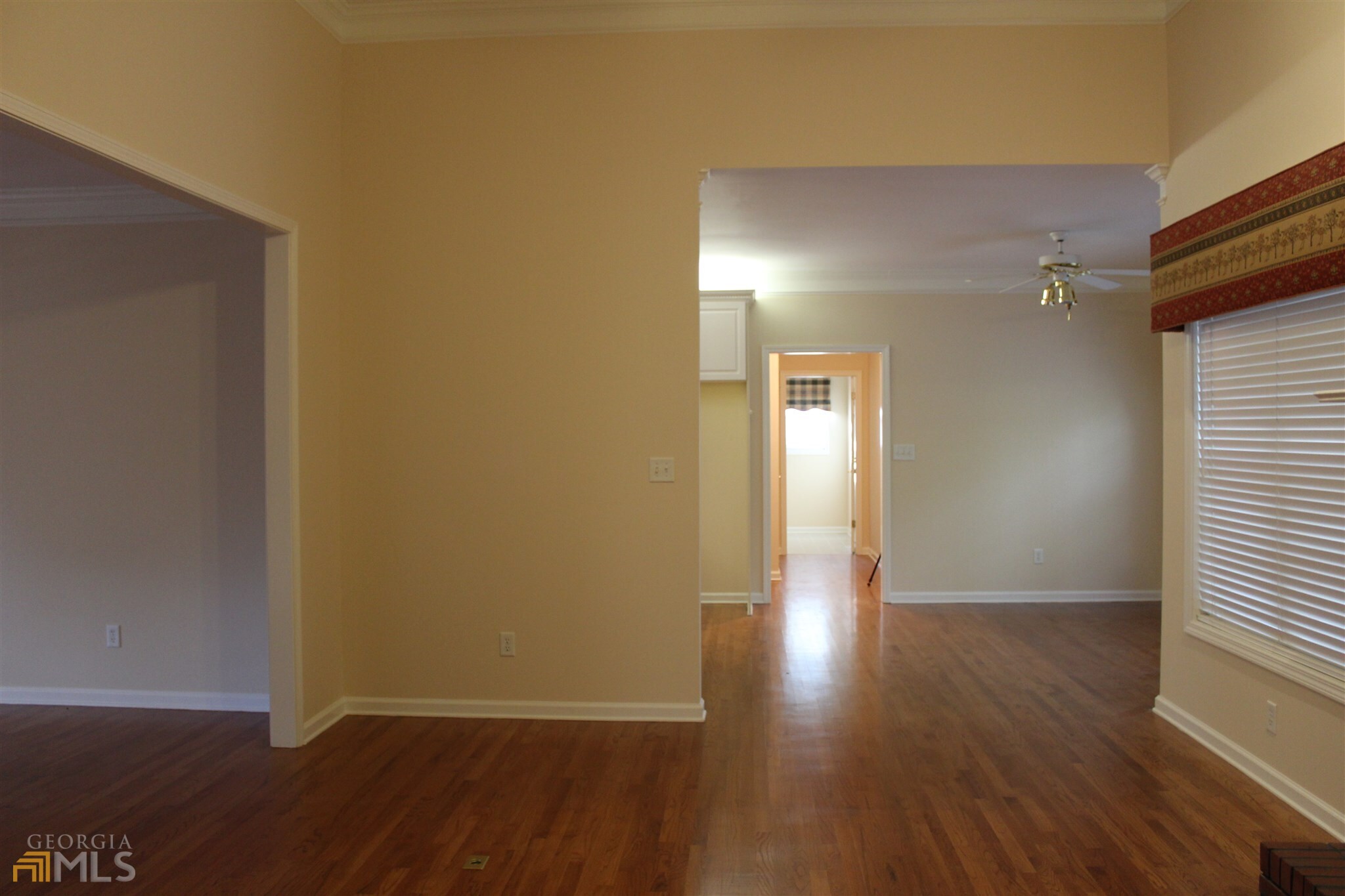 149 Walnut Ridge Drive Hoschton, GA 30548 - Photo 15 of 19 a view of a hallway with wooden floor