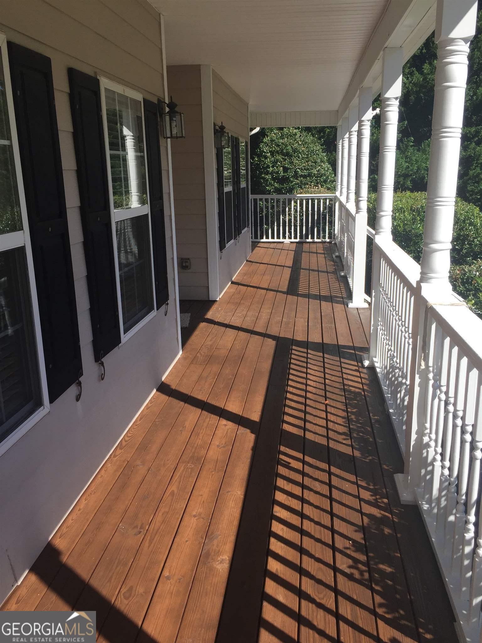 149 Walnut Ridge Drive Hoschton, GA 30548 - Photo 3 of 19 a balcony with view of car parked