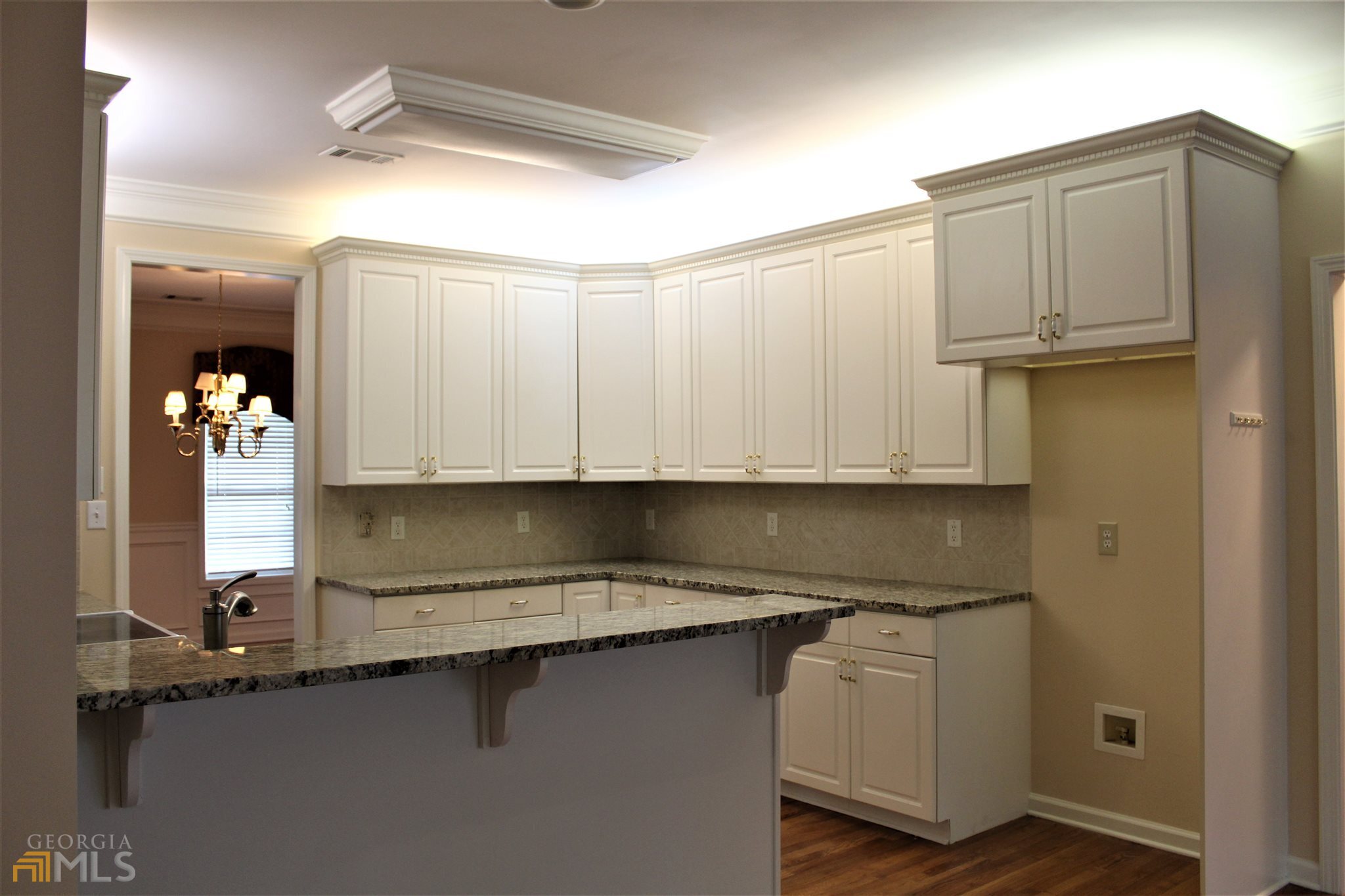 149 Walnut Ridge Drive Hoschton, GA 30548 - Photo 9 of 19 a kitchen with a sink and cabinets