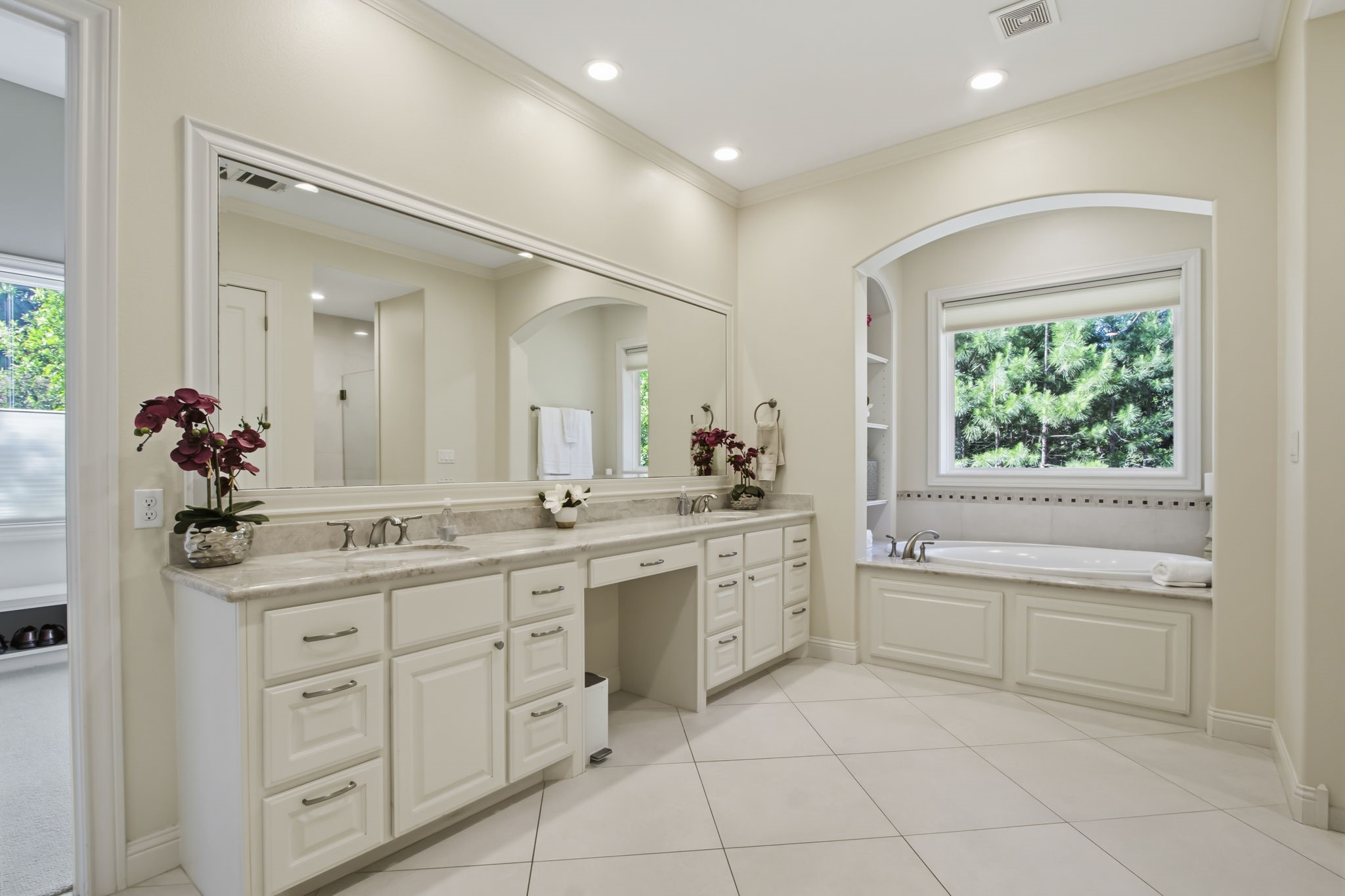 36702 Deer Valley Magnolia, TX 77355 - Photo 22 of 46 a spacious bathroom with a granite countertop sink a mirror and a bathtub
