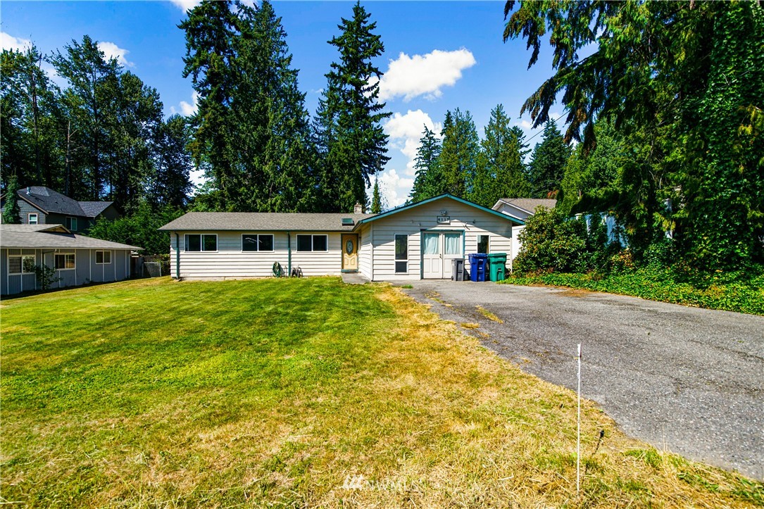 4117 212th Street Southeast Bothell, WA 98021 - Photo 1 of 32 a front view of a house with a yard
