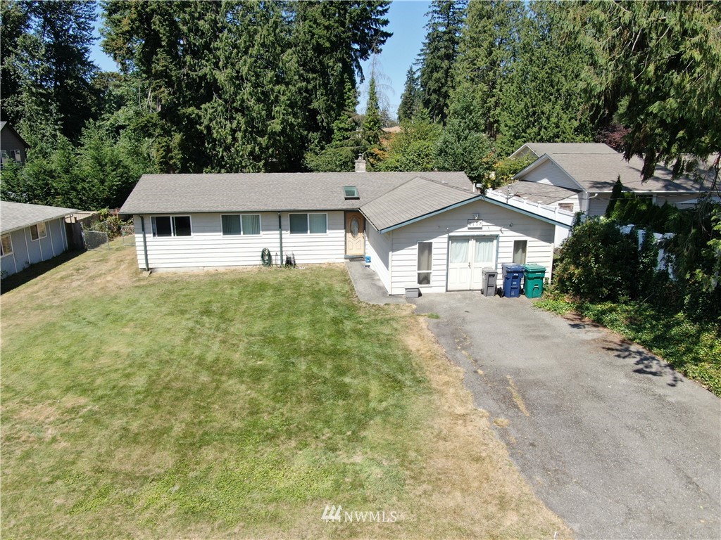 4117 212th Street Southeast Bothell, WA 98021 - Photo 2 of 32 a house with trees in front of it