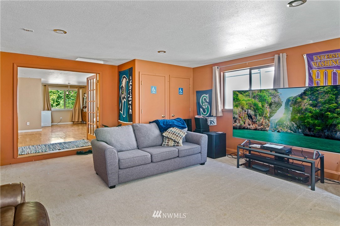 4117 212th Street Southeast Bothell, WA 98021 - Photo 13 of 32 a living room with furniture and a large window