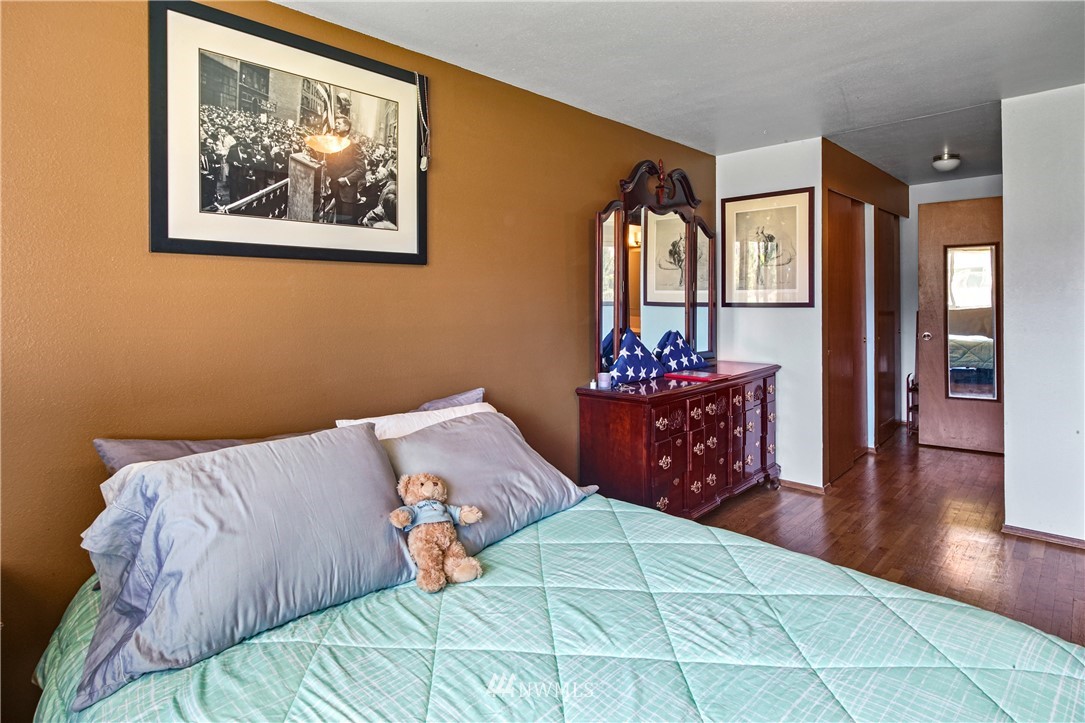 4117 212th Street Southeast Bothell, WA 98021 - Photo 19 of 32 a bedroom with a bed and a painting on the wall