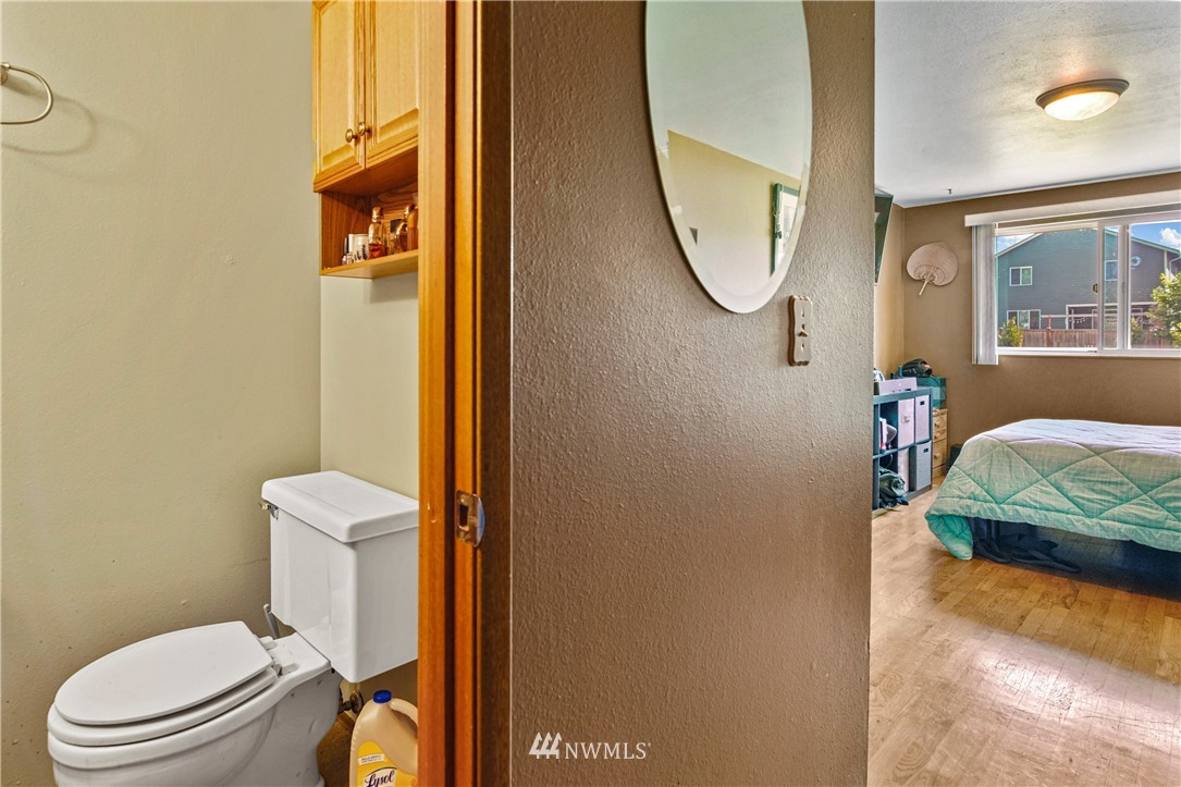4117 212th Street Southeast Bothell, WA 98021 - Photo 20 of 32 a bathroom with a toilet sink and mirror