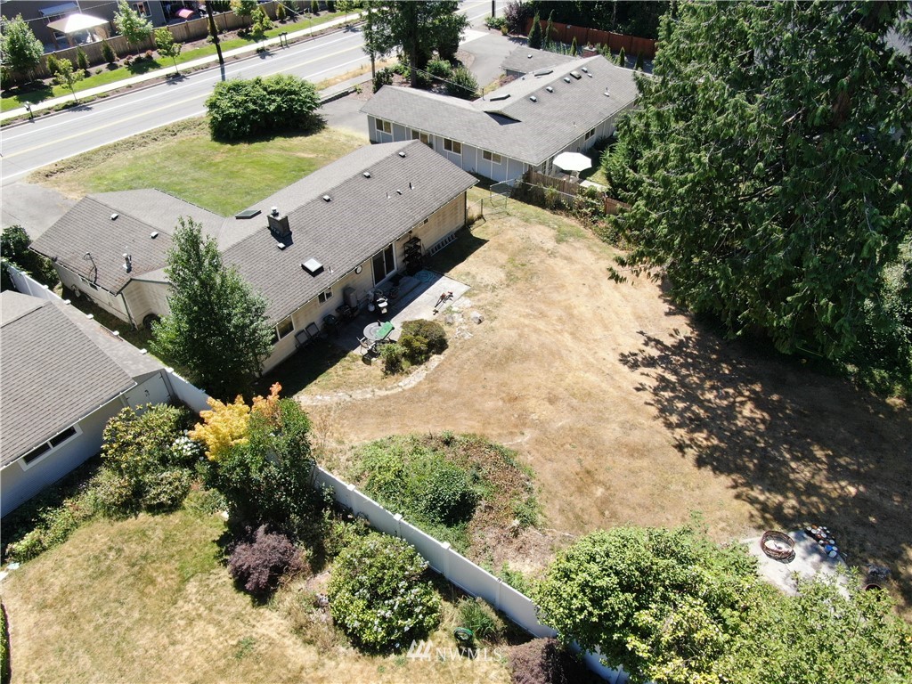 4117 212th Street Southeast Bothell, WA 98021 - Photo 3 of 32 an aerial view of a house with a yard and lake view