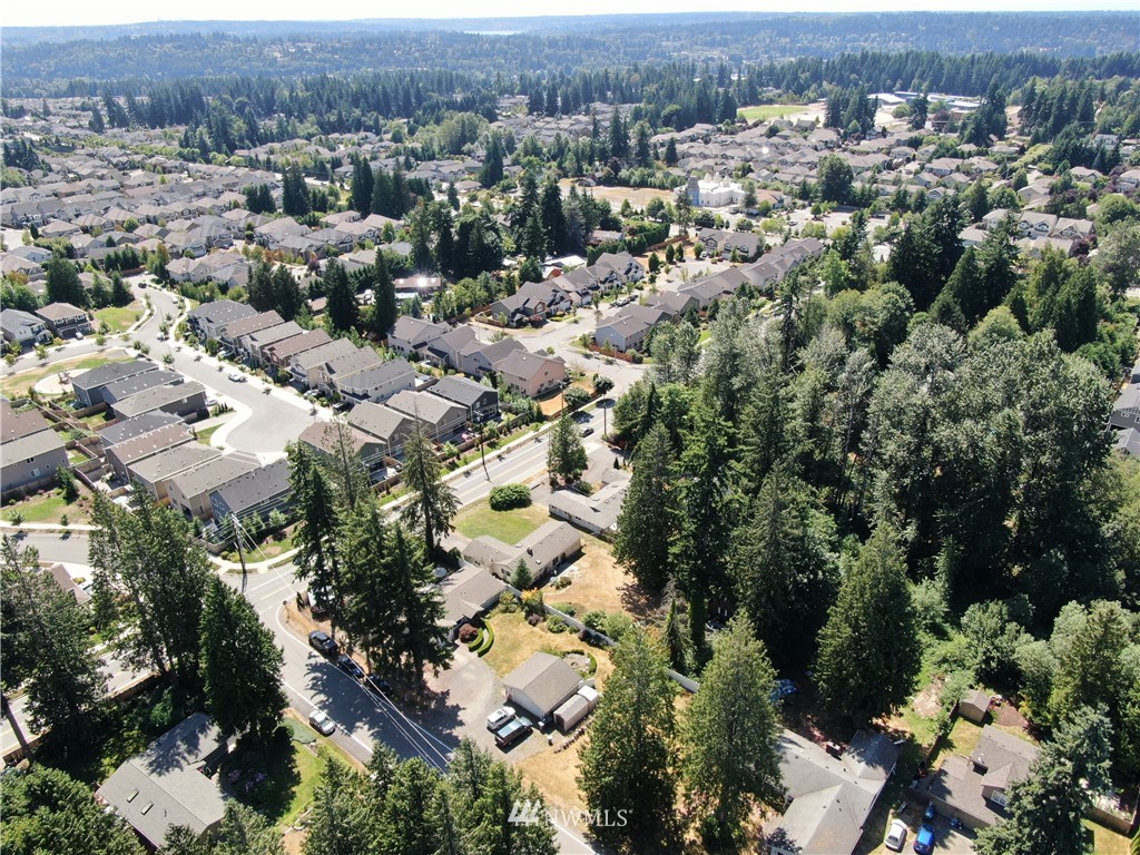 4117 212th Street Southeast Bothell, WA 98021 - Photo 4 of 32 an aerial view of residential houses with outdoor space and trees