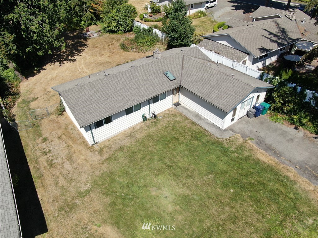 4117 212th Street Southeast Bothell, WA 98021 - Photo 32 of 32 an aerial view of a house with a yard and garage
