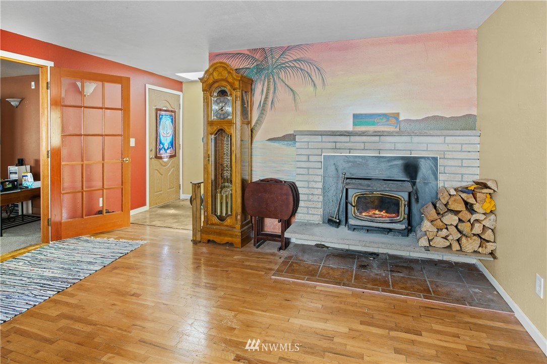 4117 212th Street Southeast Bothell, WA 98021 - Photo 7 of 32 a living room with furniture and a fireplace