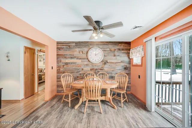 a kitchen with stainless steel appliances kitchen island granite countertop a sink stove and refrigerator