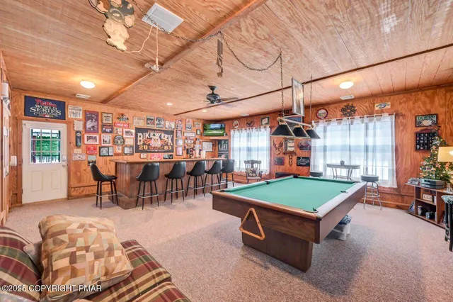 a dining table and chairs in a room