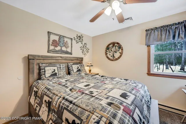 a bedroom with a large bed and a window