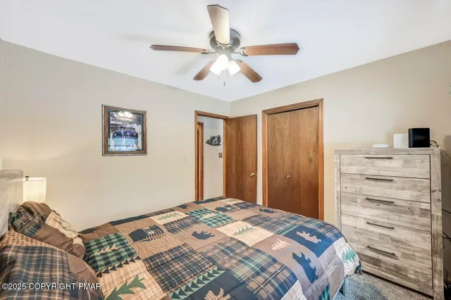 a view of a patio with a table and chairs under an umbrella