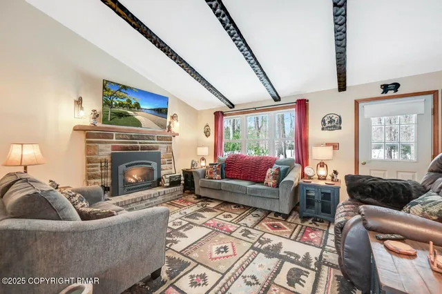 a living room with furniture and a rug