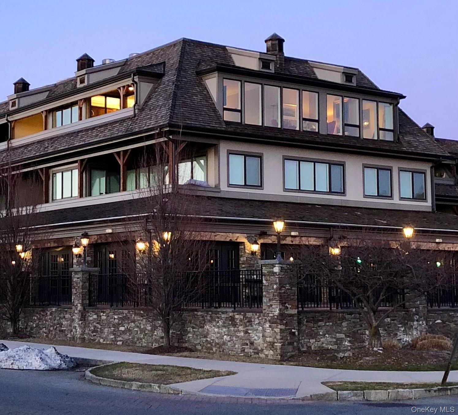 a view of a building with retail shops