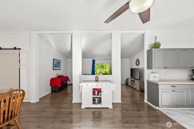 a living room with furniture and flat screen tv