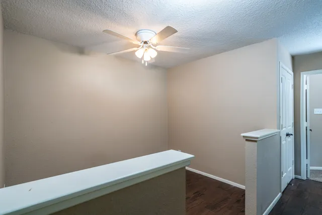 a view of a small space with wooden floor