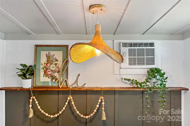 a front view of a house with wooden floor and a chair