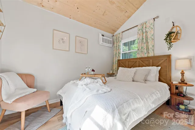 a bedroom with a bed and a chair