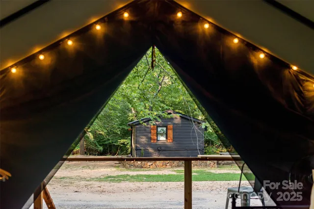 a view of house with yard