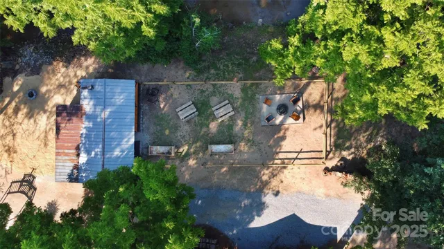 an aerial view of a house with swimming pool garden and patio