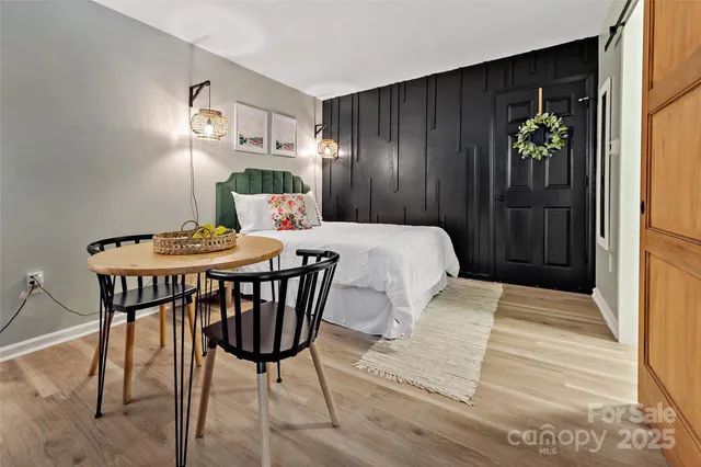 a bedroom with a bed and a table in it