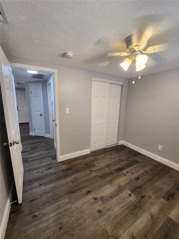 8012 Emi Ann Lane Riverview, FL 33578 - Photo 11 of 16 wooden floor in an empty room with a window