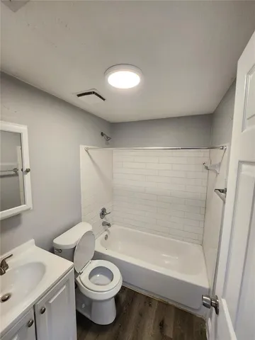 a bathroom with a sink a toilet and a bathtub