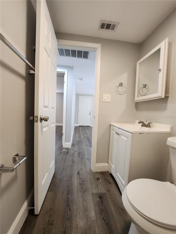 8012 Emi Ann Lane Riverview, FL 33578 - Photo 15 of 16 a white toilet sitting next to a bathroom sink