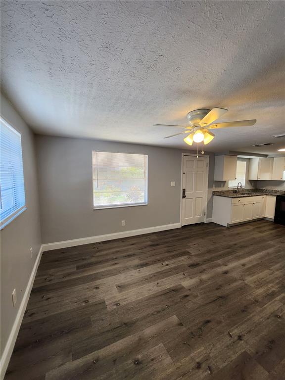 8012 Emi Ann Lane Riverview, FL 33578 - Photo 6 of 16 an empty room with wooden floor and windows