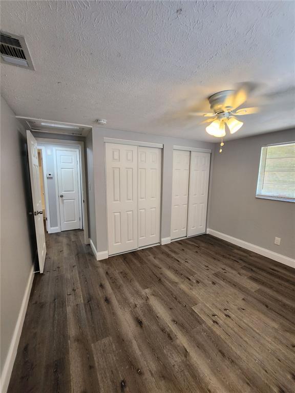 8012 Emi Ann Lane Riverview, FL 33578 - Photo 8 of 16 wooden floor in an empty room with a window