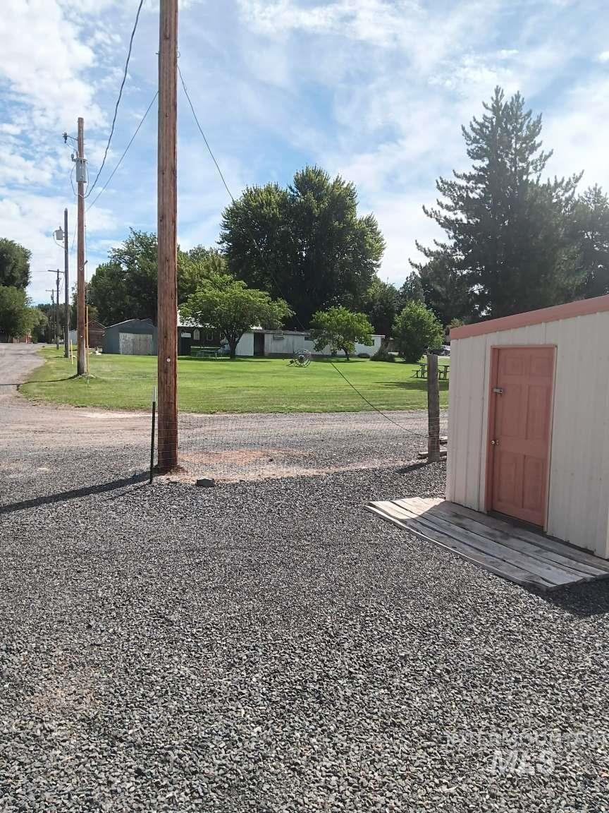 269 South State Street Hagerman, ID 83332 - Photo 12 of 29 View of green lawn featuring a shed