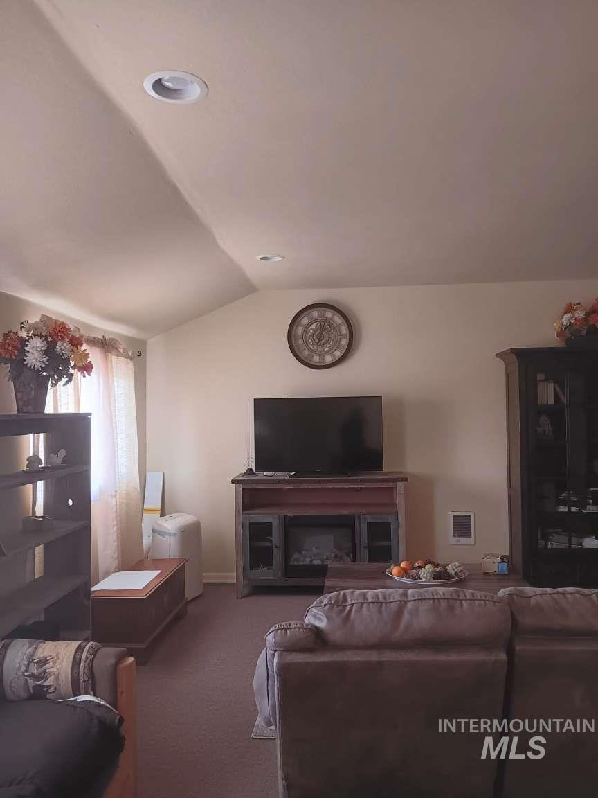 269 South State Street Hagerman, ID 83332 - Photo 23 of 29 Living room with vaulted ceiling, carpet, and recessed lighting