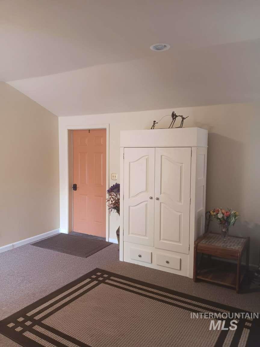 269 South State Street Hagerman, ID 83332 - Photo 24 of 29 Bedroom featuring dark colored carpet and a closet