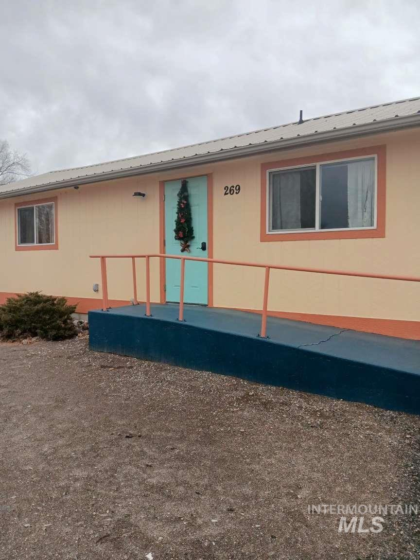 269 South State Street Hagerman, ID 83332 - Photo 9 of 29 View of side of home with a metal roof