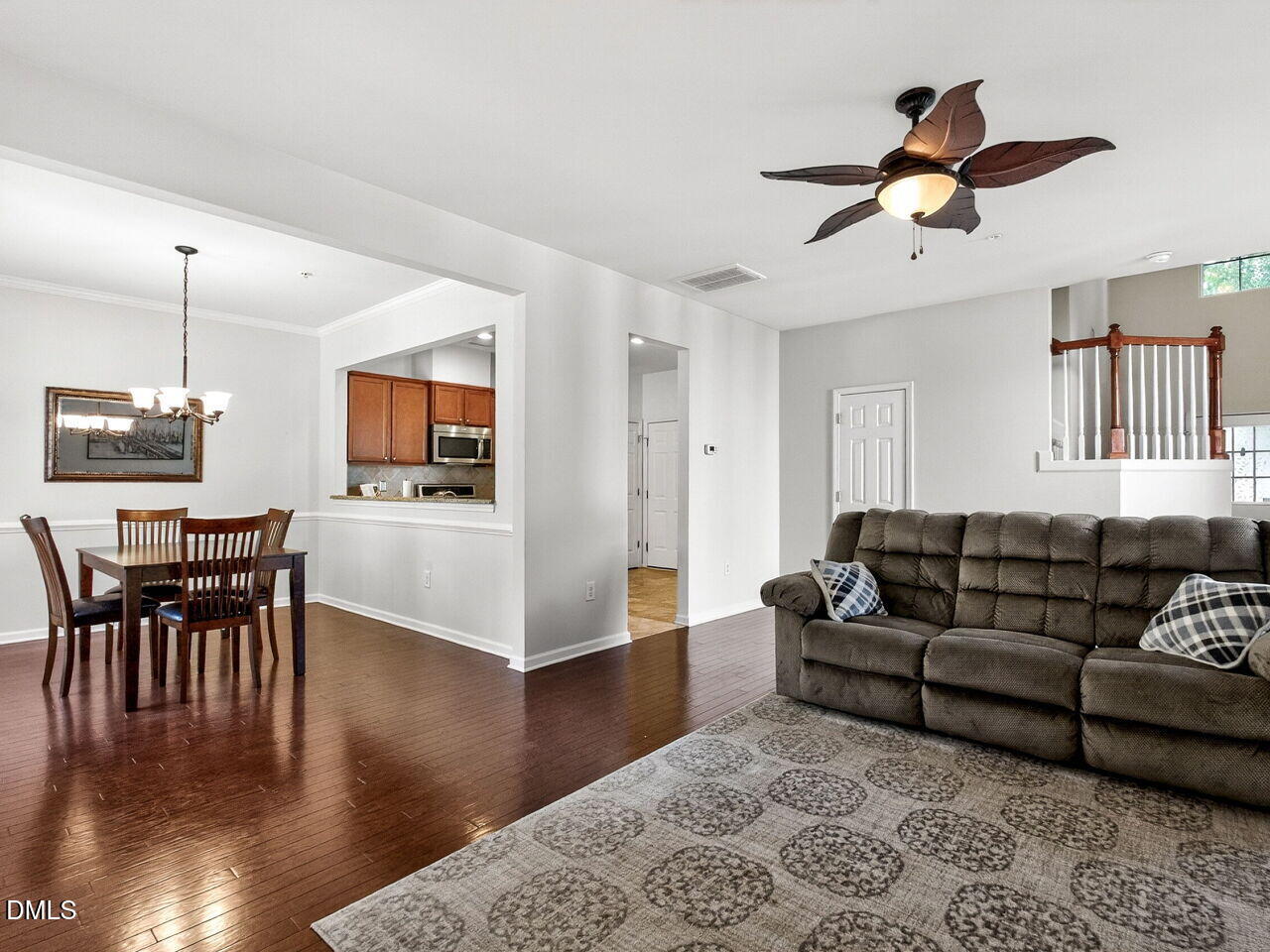 8215 Yaxley Hall Drive Raleigh, NC 27616 - Photo 11 of 42 a living room with furniture wooden floor and a dining table