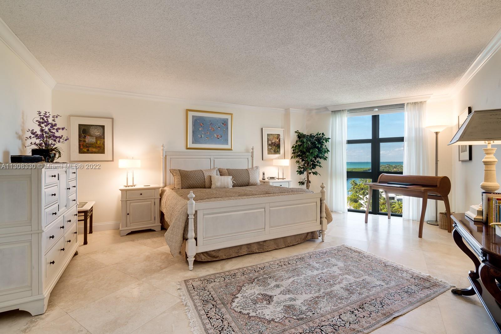 1121 Crandon Boulevard, Unit E1101 Key Biscayne, FL 33149 - Photo 14 of 31 a living room with furniture and a rug