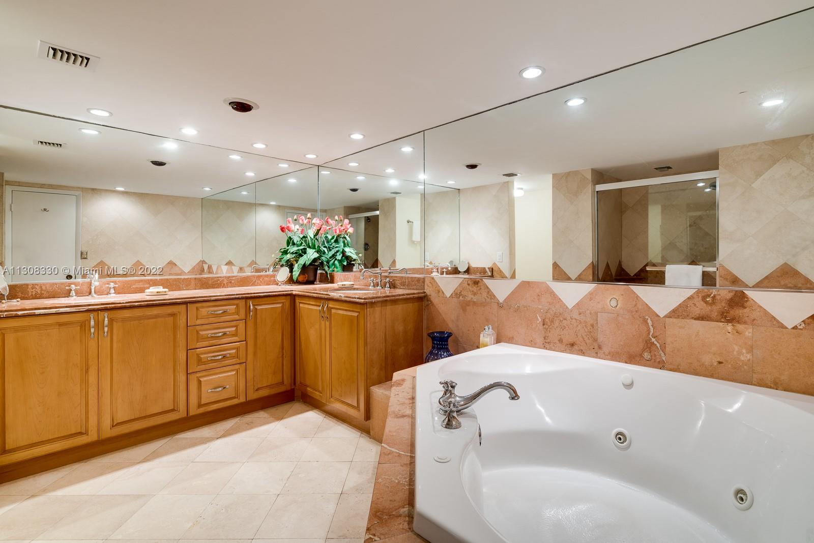 1121 Crandon Boulevard, Unit E1101 Key Biscayne, FL 33149 - Photo 15 of 31 a large kitchen with lots of counter space and a sink