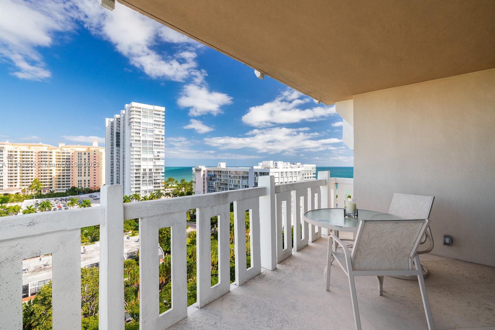 1121 Crandon Boulevard, Unit E1101 Key Biscayne, FL 33149 - Photo 18 of 31 a view of a balcony with furniture